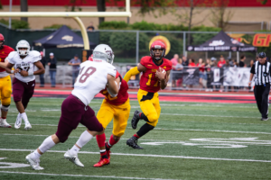Guelph Gryphons running the ball during the homecoming game.