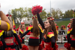 Crowd celebrating at homecoming game.