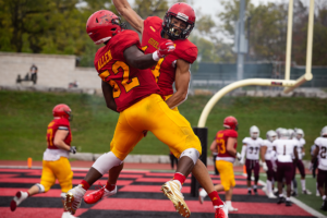 Guelph Gryphons celebrate a touchdown during their homecoming game.