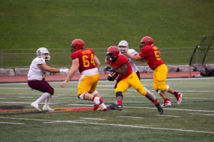 Guelph Gryphons running the ball during the homecoming game.