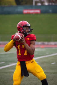 Guelph Gryphons quarterback winds up to throw the ball during the homecoming game.