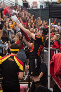 Crowd celebrating at homecoming game.