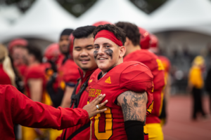 Gryphon player on the sideline during homecoming game.