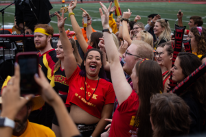 Crowd celebrating at homecoming game.