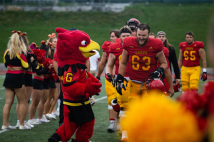 Gryphon players walk on the field in between halves at the homecoming game.
