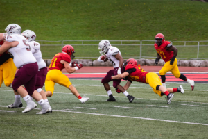 Guelph Gryphons running the ball during the homecoming game.