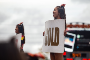 Crowd celebrating at homecoming game.
