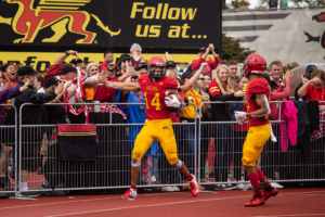 Guelph Gryphons celebrate a touchdown during their homecoming game.