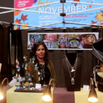 Jewelry Maker sitting at her stand