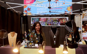 Jewelry Maker sitting at her stand