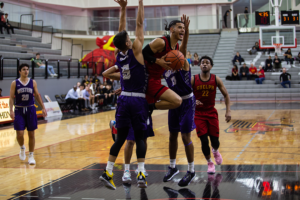 Malcolm Glanville, #15, rushes for a basket against the Western Mustangs on Nov 30.