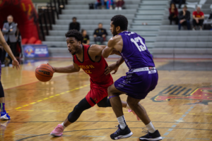 Rasheed Weekes, #22 rushes for a basket against the Western Mustangs on Nov 30.