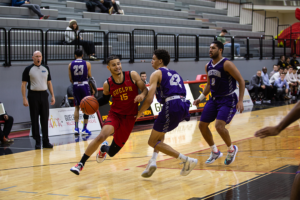 Malcolm Glanville, #15, rushes for a basket against the Western Mustangs on Nov 30.