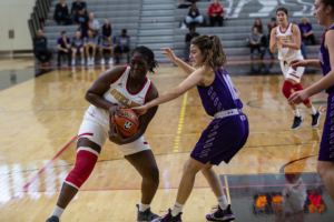 Modupe Okeowo, #15, holds on to the ball during a game against the Western Mustangs on Nov. 30.
