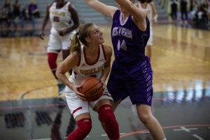 Ashley Wheeler, #6, takes aim for a basket against the Western Mustangs on Nov. 30.