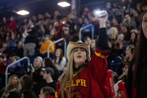 Girl waves her phone at Frosty Mug 2020