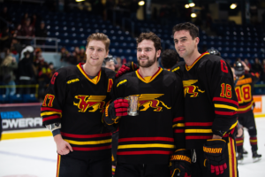 U of G players pose with a mug after winning Frosty Mug 2020