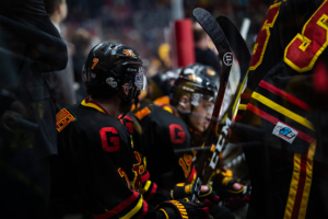 #7 Zach McFadden watching the game from the bench.