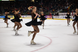 Figure skaters twirling during their routine at Frosty Mug 2020.