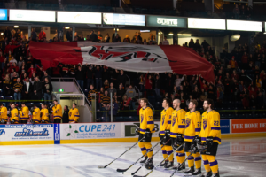 Laurier players stand during the anthem at Frosty Mug 2020.