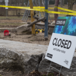Close up of a sign reading "Closed until further notice"
