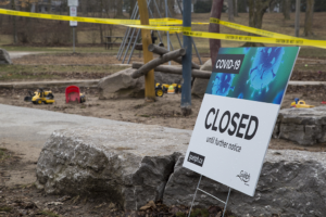 Close up of a sign reading "Closed until further notice"